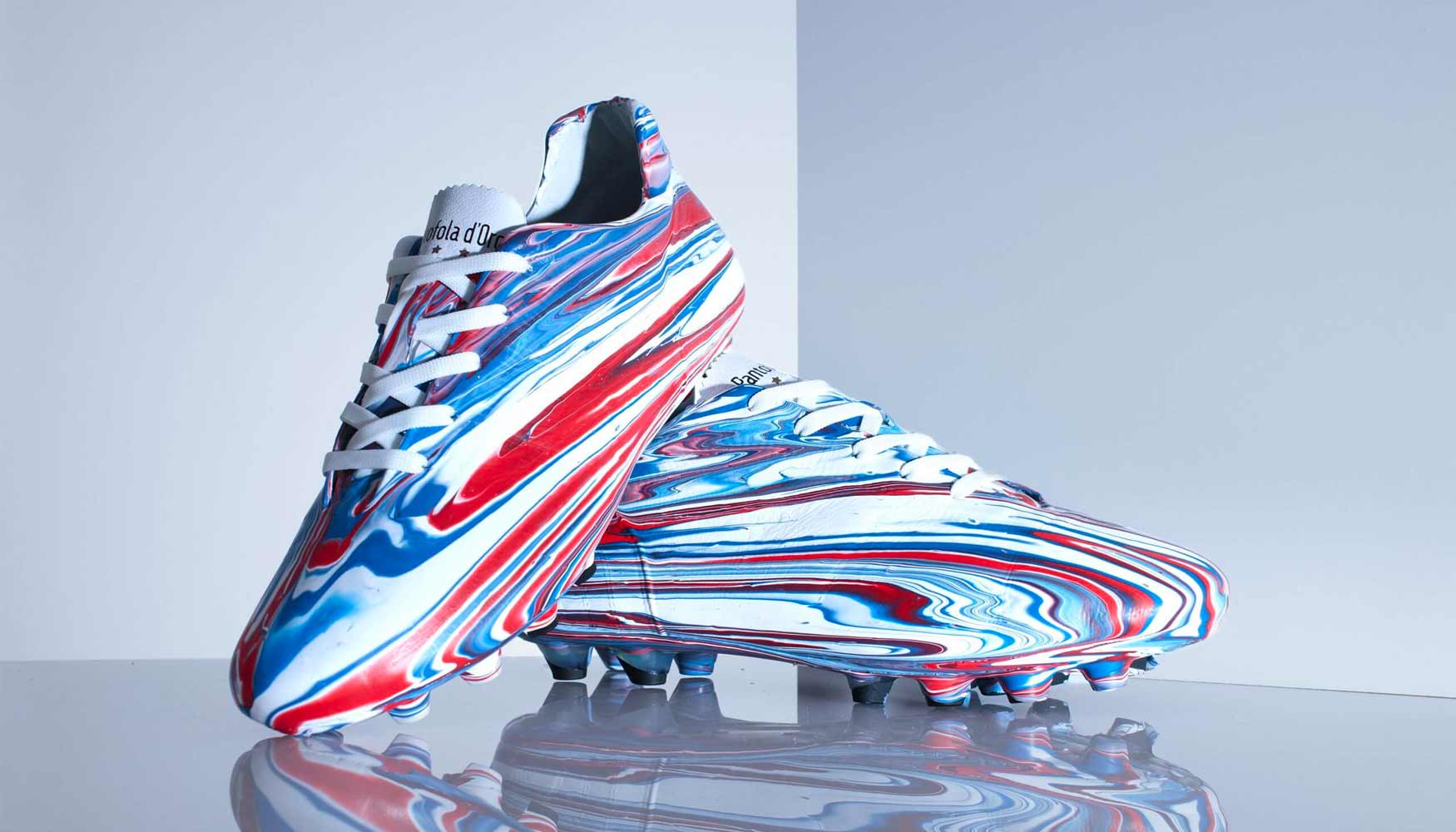 One of a kind Pantofola d'Oro ‘Lazzarini’ football boots created by Craig Black for Ranger FC using an acrylic fusion paint–pouring technique in the clubs red, white and blue.